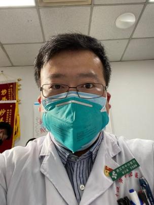 Li Wenliang who tried to alert his colleagues to the danger of a new coronavirus but was punished by the Chinese authorities. Pictured in a green mask, white gown, he is 34 years old and wears glasses.